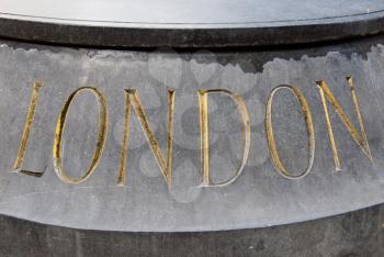 London inscription written in golden letters in stone