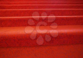 stairs with red carpet fabric useful as a background