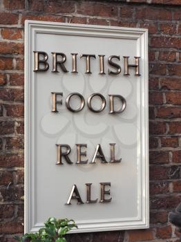 british food real ale sign on a pub wall