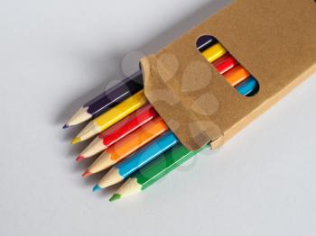 colour pencil crayons in a cardboard box