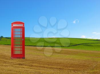 urban rural contrast - red London telephone box in the country