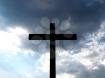 Christian Cross over a blue sky background