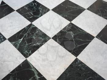 chequered white green and black stone floor useful as a background