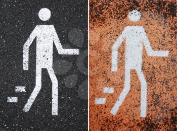 Royalty Free Photo of Pedestrian Crossing Signs on Pavement