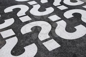 Royalty Free Photo of Question Signs Painted on Pavement
