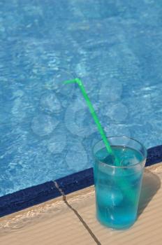 Royalty Free Photo of a Cocktail Beside a Pool