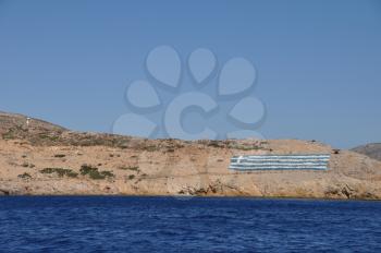 Royalty Free Photo of the National Flag on a Greek Island