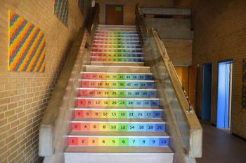 Rainbow colored stairs in a school building