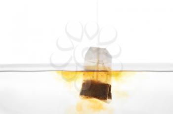 Brewing of hot beverage with tea bag, closeup�