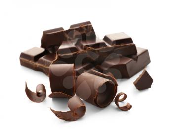 Pieces of chocolate with curls on white background�