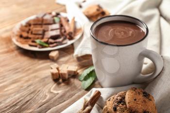 Cup of hot chocolate on wooden table�
