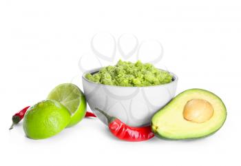 Composition with delicious guacamole on white background�