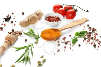 Fresh tomatoes and variety of spices on white background�