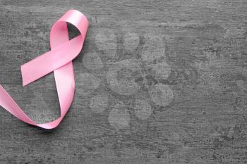 Pink ribbon on grey background. Breast cancer concept�