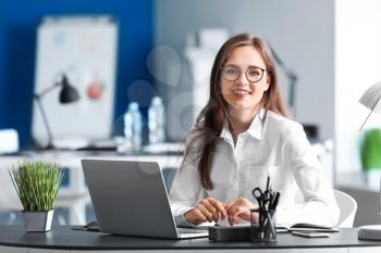 Young businesswoman working in office�