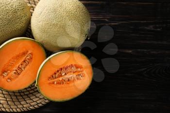 Ripe melons on wooden background�