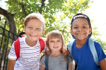 Cute little schoolchildren outdoors�