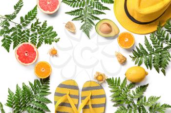Summer composition with fresh tropical leaves, fruits and beach accessories on white background�