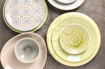 Set of clean color plates on table�