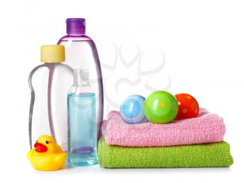 Baby cosmetics and towels on white background�