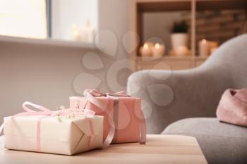 Beautiful gift boxes on wooden table�