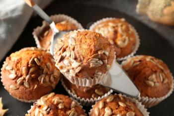 Delicious pumpkin muffins with sunflower seeds, closeup�