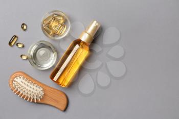 Flat lay composition with natural cosmetics for hair on grey background�