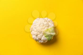 Fresh cauliflower on color background, top view�