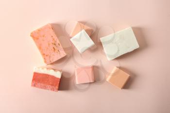 Handmade soap bars on color background, flat lay�