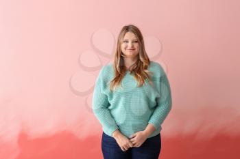 Beautiful plus size girl on color background. Concept of body positivity�