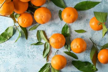 Tasty juicy tangerines on light background�