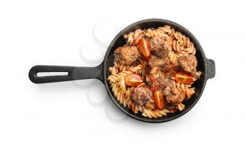 Tasty pasta with tomato sauce and meat in pan on white background�