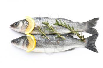 Tasty fresh seabass fish with lemon and rosemary on white background�