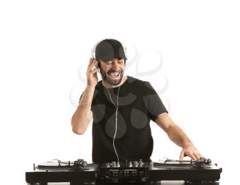 Male DJ playing music on white background�