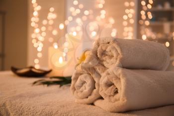 Rolled towels on table in spa salon�