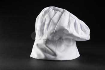 Chef's hat on dark background�