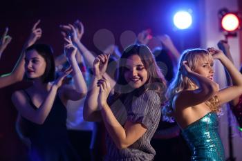 Beautiful young women dancing in night club�