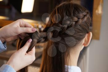 Hairdresser working with client in beauty salon�