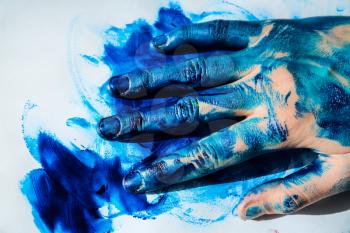 Painted female hand on paper, closeup�