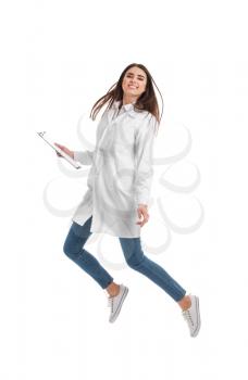Happy female doctor jumping against white background�