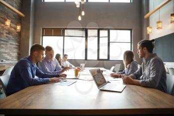 Young people having business meeting in modern office�