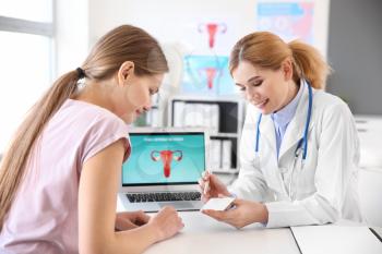 Young woman visiting her gynecologist in clinic�