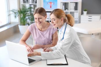 Young woman visiting her gynecologist in clinic�