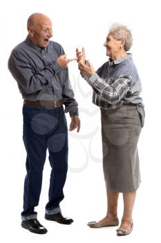 Talking senior couple on white background�