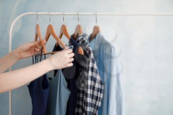 Woman choosing clothes in dressing room�