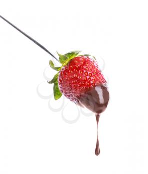 Fondue stick with chocolate covered strawberry on white background�