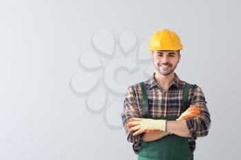Male worker on light background�
