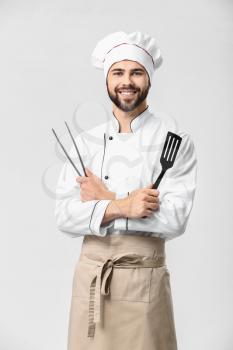 Handsome male chef on white background�