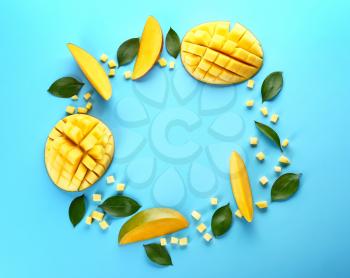 Frame made of tasty fresh mango on color background�