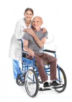 Elderly man with doctor on white background 